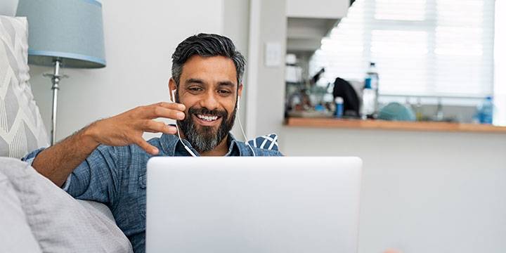 Man working on a laptop from home